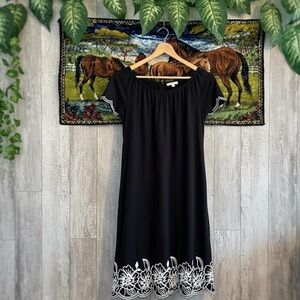 Chic Black Dress with White Floral Detail